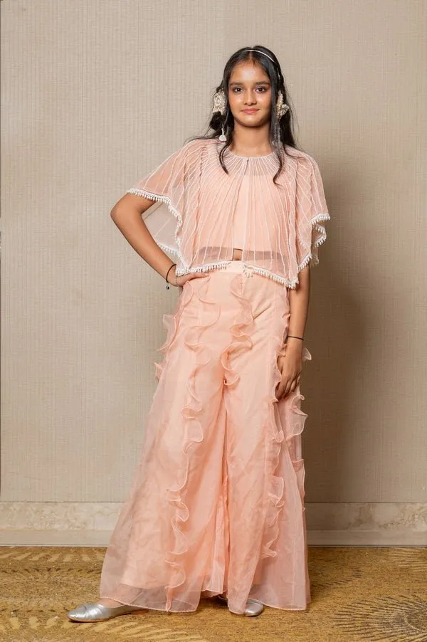 Chic Peach ensemble with beaded cape and ruffled palazzo pants, perfect for a stylish and elegant look at any occasion.