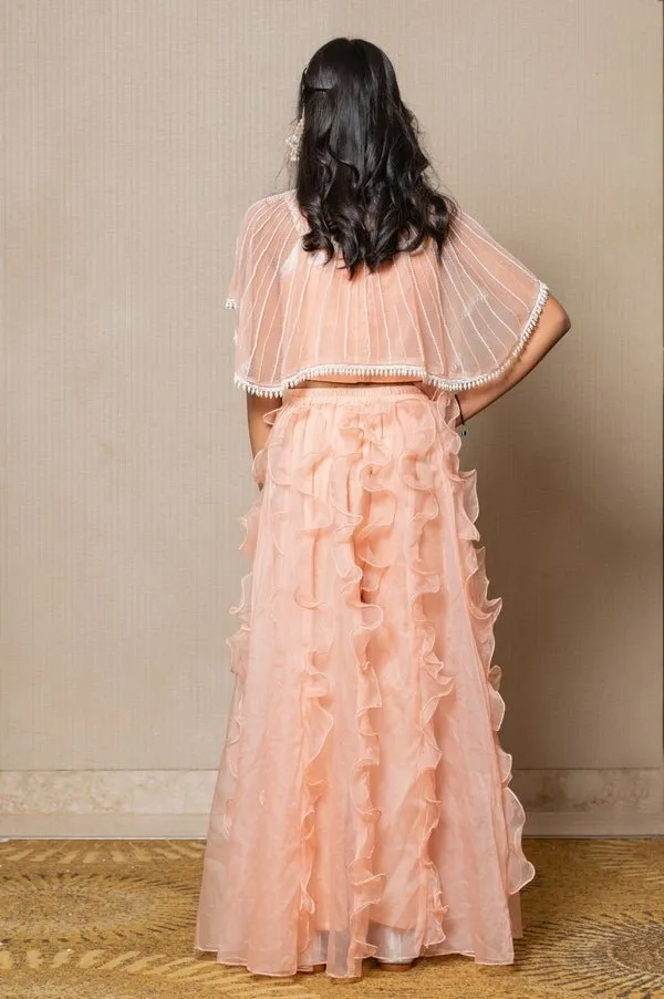 Chic Peach ensemble with beaded cape and ruffled palazzo pants, perfect for a stylish and elegant look at any occasion.